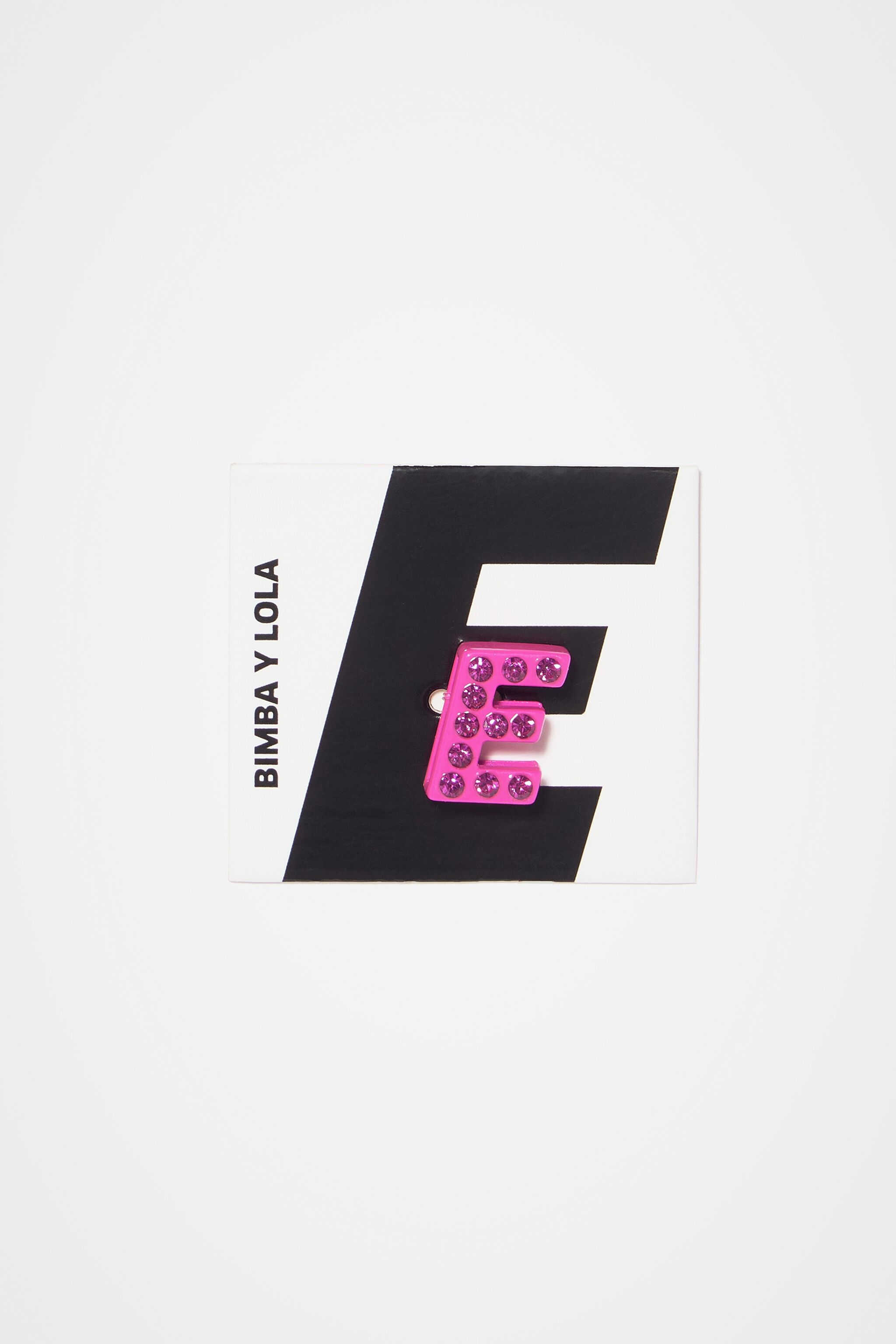 Neon pink letter E metal charm
