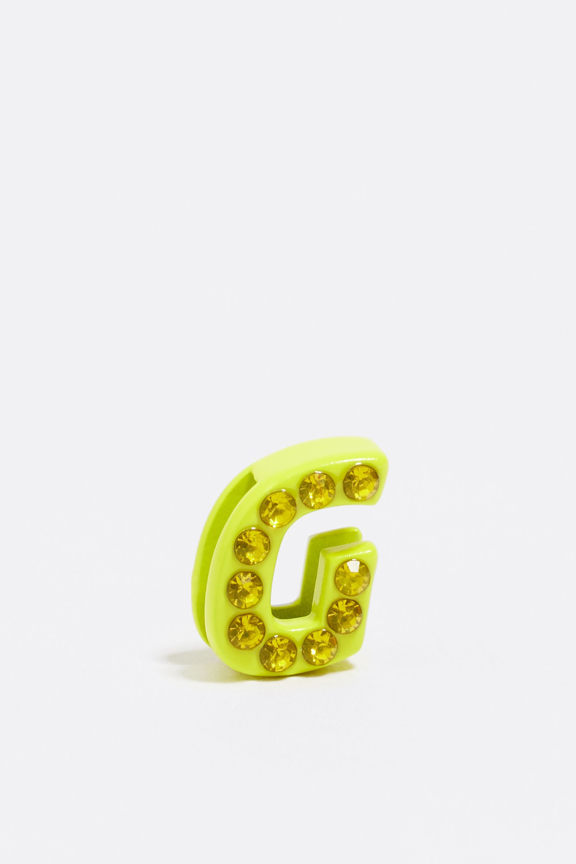 Neon yellow letter G metal charm