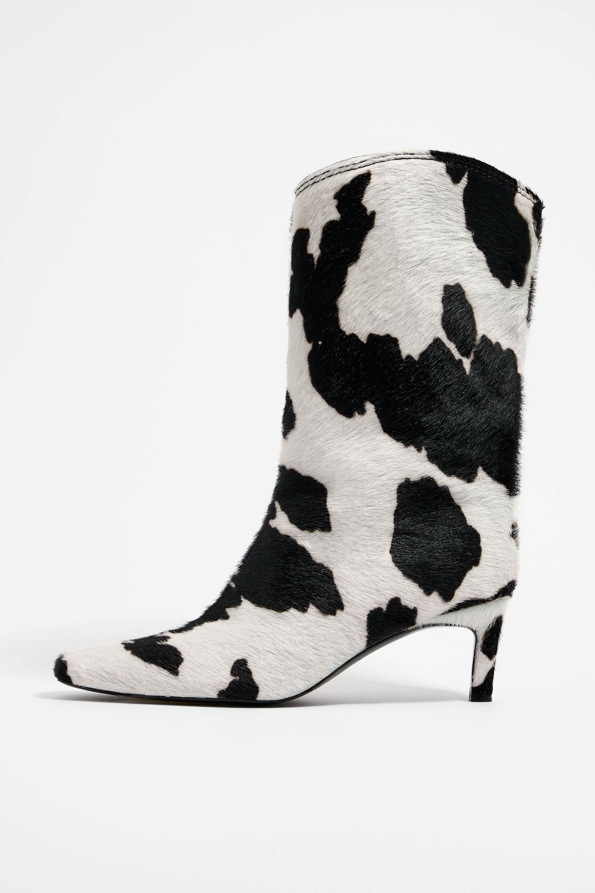 Cow print leather heeled gaucho boot