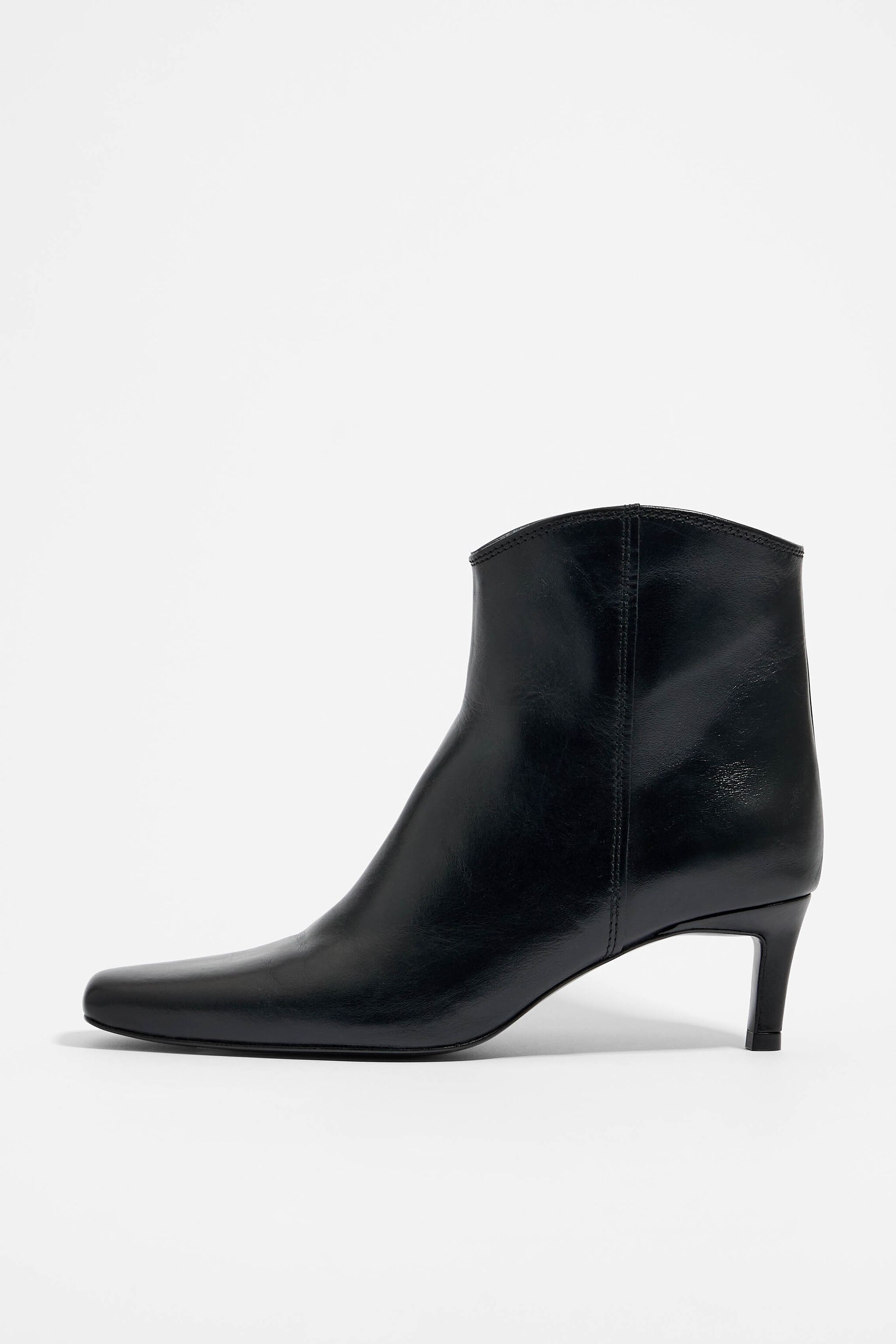 Black leather heeled gaucho ankle boot
