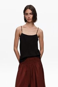 Black strappy top with decorative stones