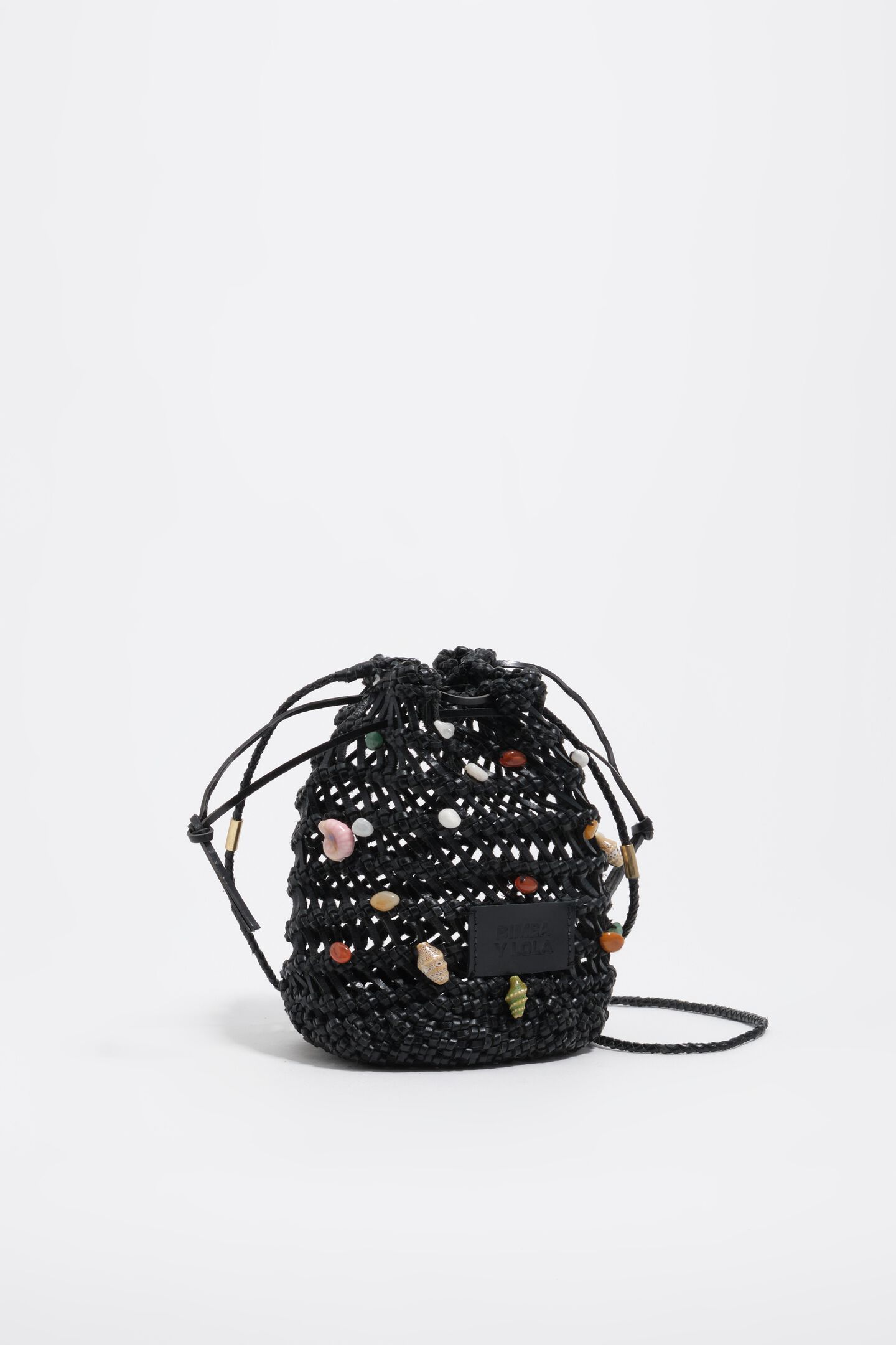 Black mini bucket bag in plaited leather with natural stones