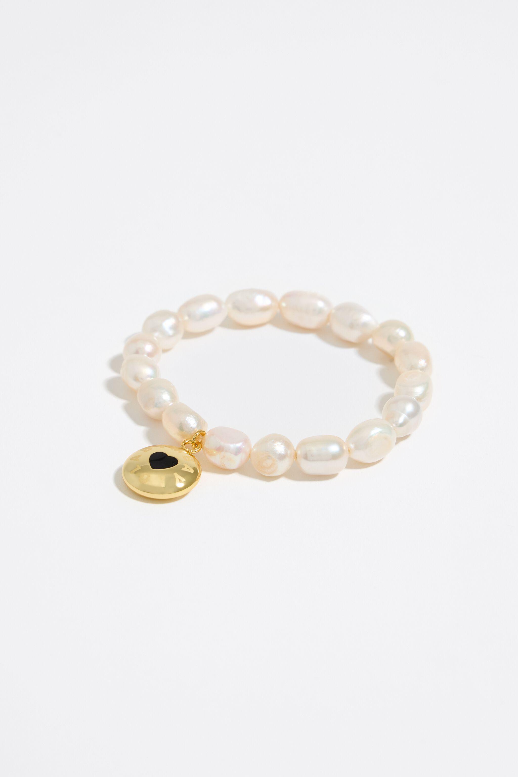 Personalized freshwater white pearls bracelet with monogrammed initials in  heart shape.