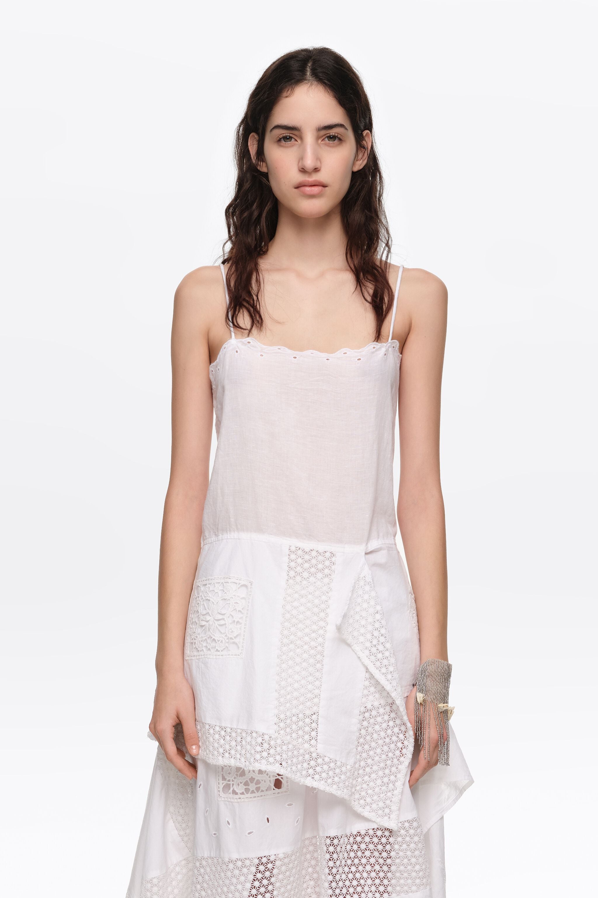 White embroidered top with asymmetrical handkerchief hem