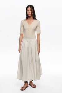 Falda l&iacute;nea A rayas marfil