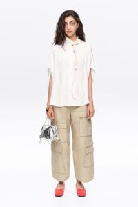 White knotted neckline cape shirt