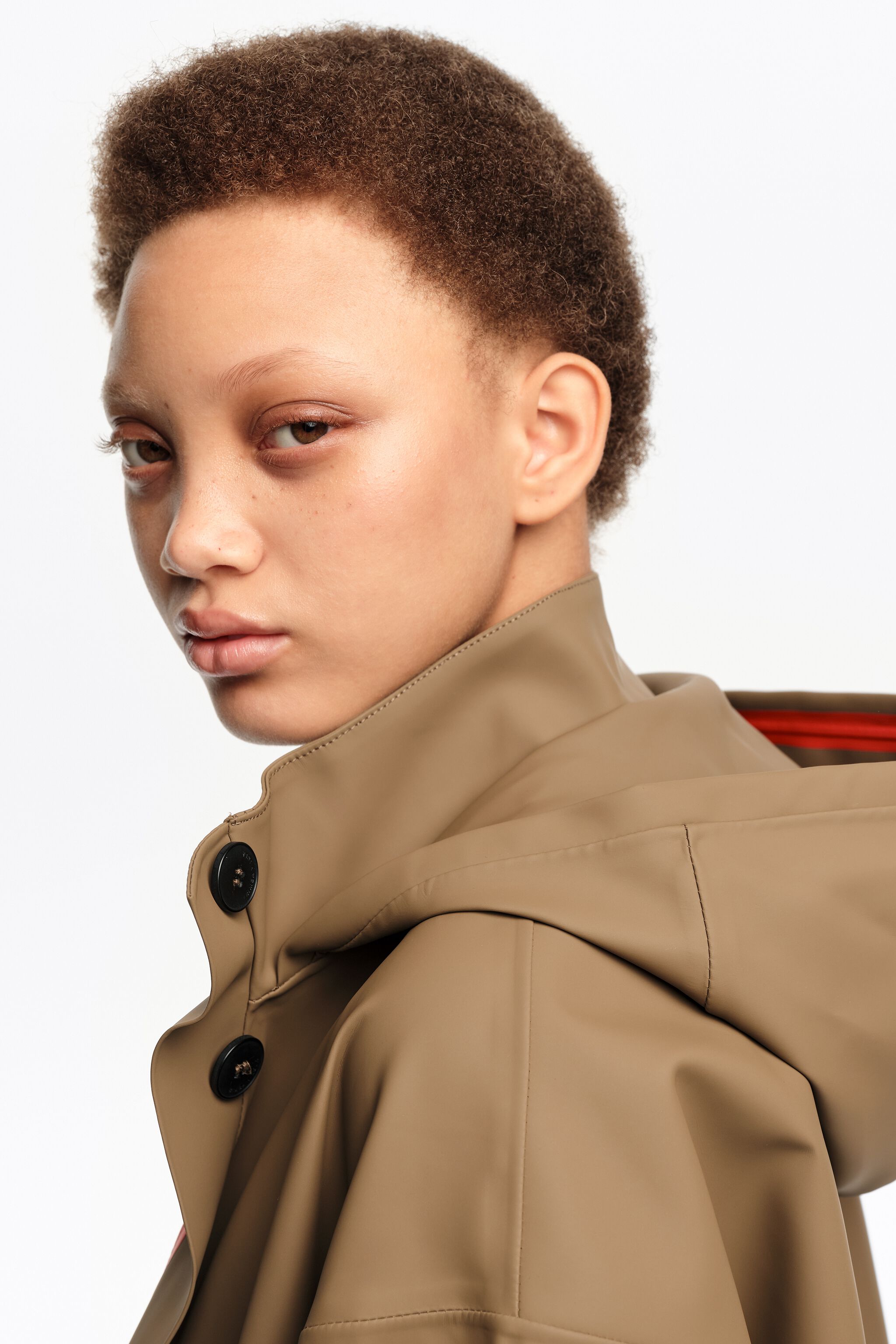 Dark camel rubberized A-line trench
