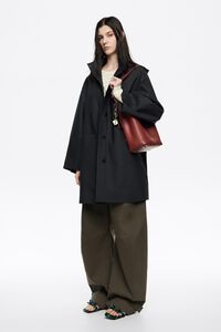 Dark blue rubberized A-line trench