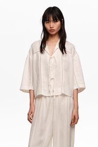 White linen shirt with ties and lace