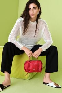 Ivory ribbed sweater with batwing sleeves and buttons
