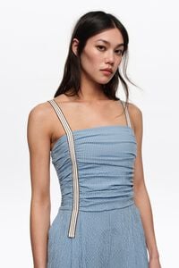 Blue striped jumpsuit with gathered straps