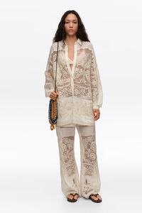 Ecru trousers with embroidery and openwork
