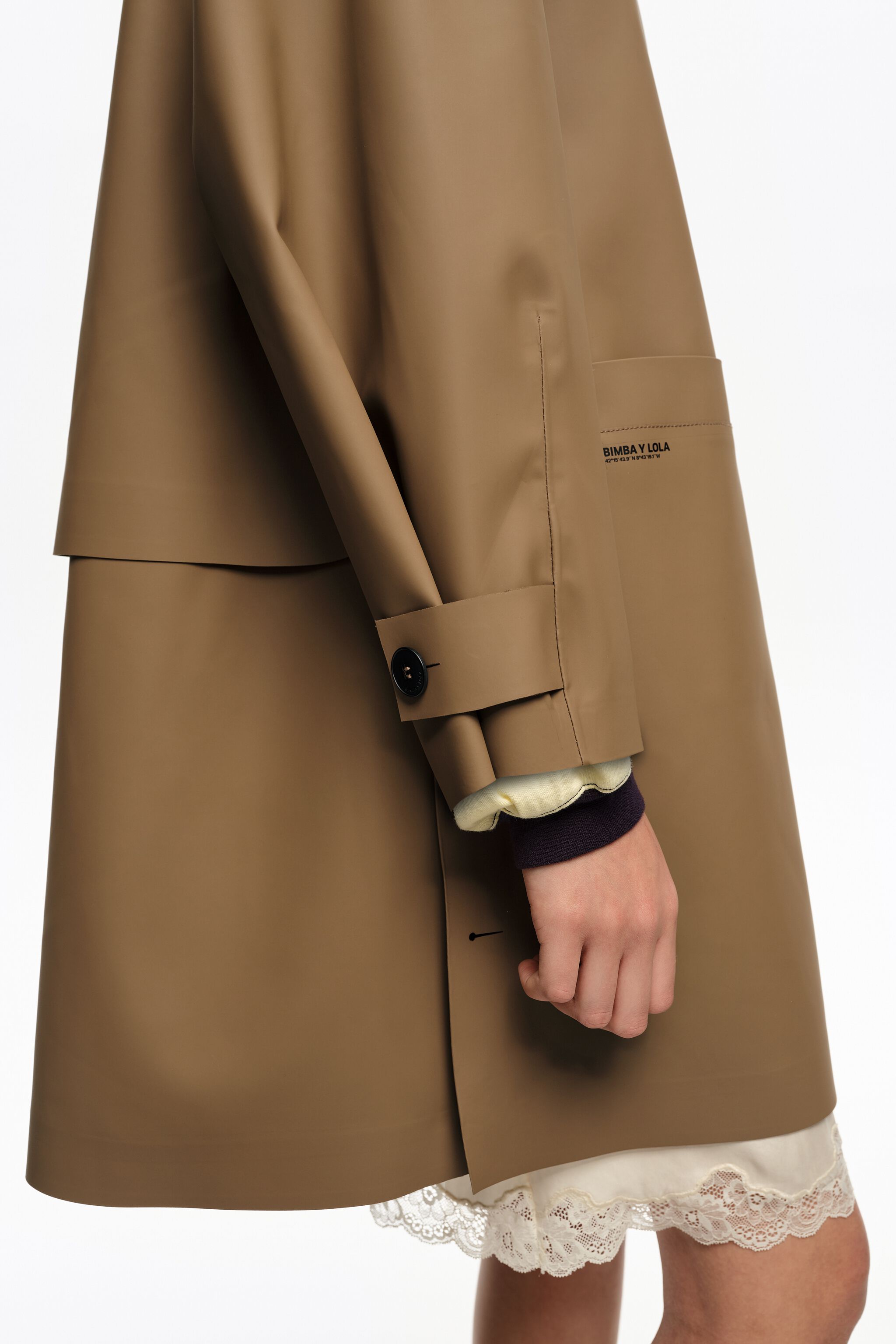 Dark camel rubberized A-line trench