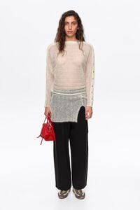 Ivory ribbed sweater with batwing sleeves and buttons
