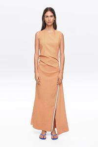 Sleeveless dress with orange striped overlay strap
