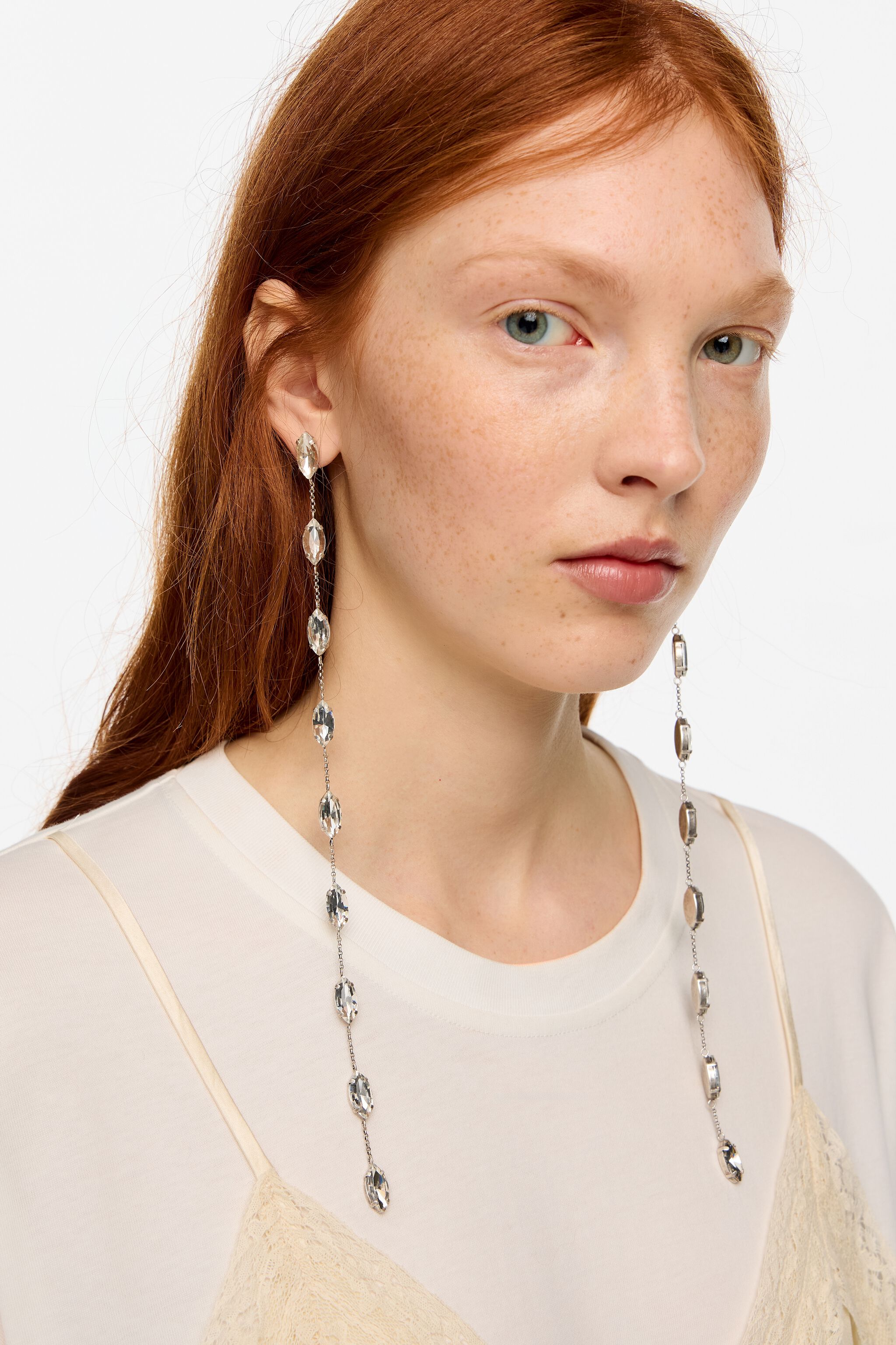 Crystals and aged silver-tone chain earrings