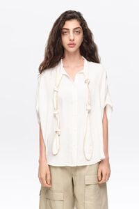 White knotted neckline cape shirt
