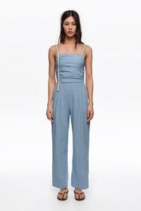 Blue striped jumpsuit with gathered straps
