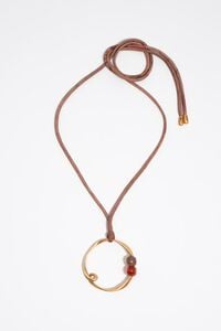 Collar aro irregular y piedras dorado mate