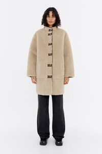 Двостороннє бежеве хутряне пальто
