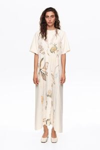 Ivory printed dress with lace detailing on bib