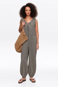Black checked baggy jumpsuit with bows and frayed details