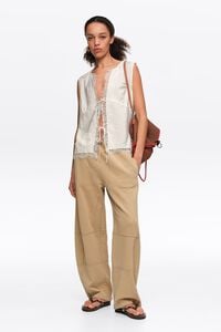 White short-sleeve shirt with lace and ties