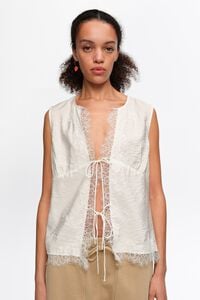 Camisa de sisa amb encaixos i cordons blanca