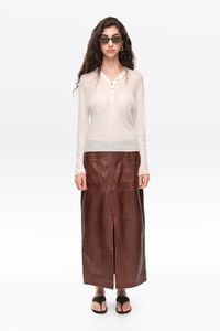 Ivory ribbed sweater with buttoned neckline