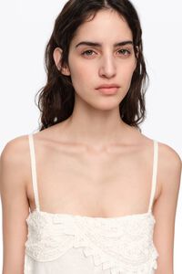 White linen crochet neckline jumpsuit
