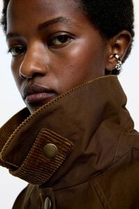 Short dark olive trench with contrast corduroy