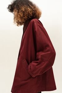 Short burgundy coated trench