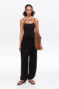Black textured cotton harem trousers