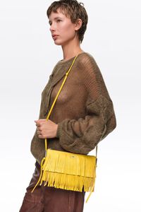 Small lemon leather fringed clutch bag