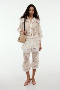 Ecru trousers with embroidery and openwork