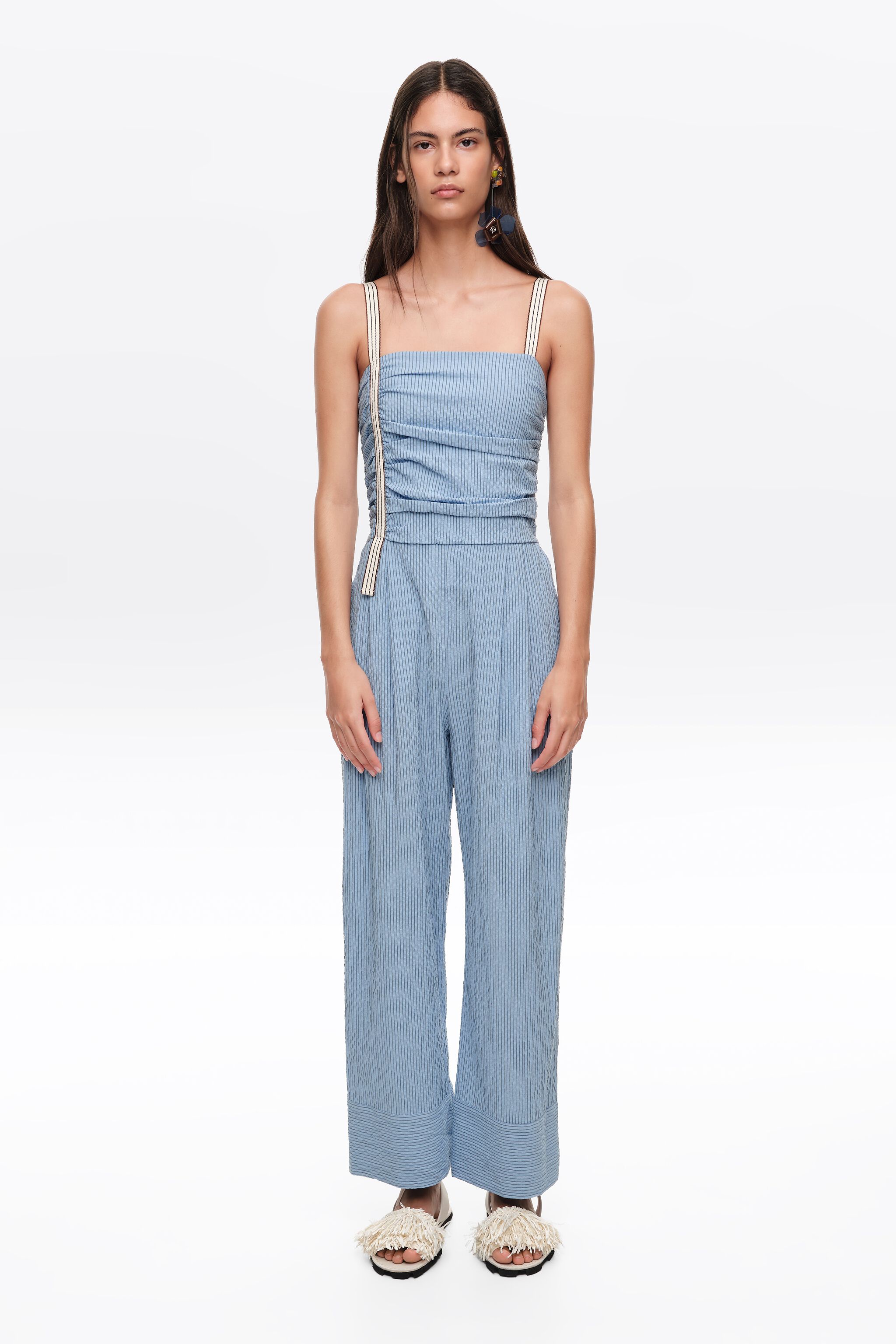 Blue striped jumpsuit with gathered straps