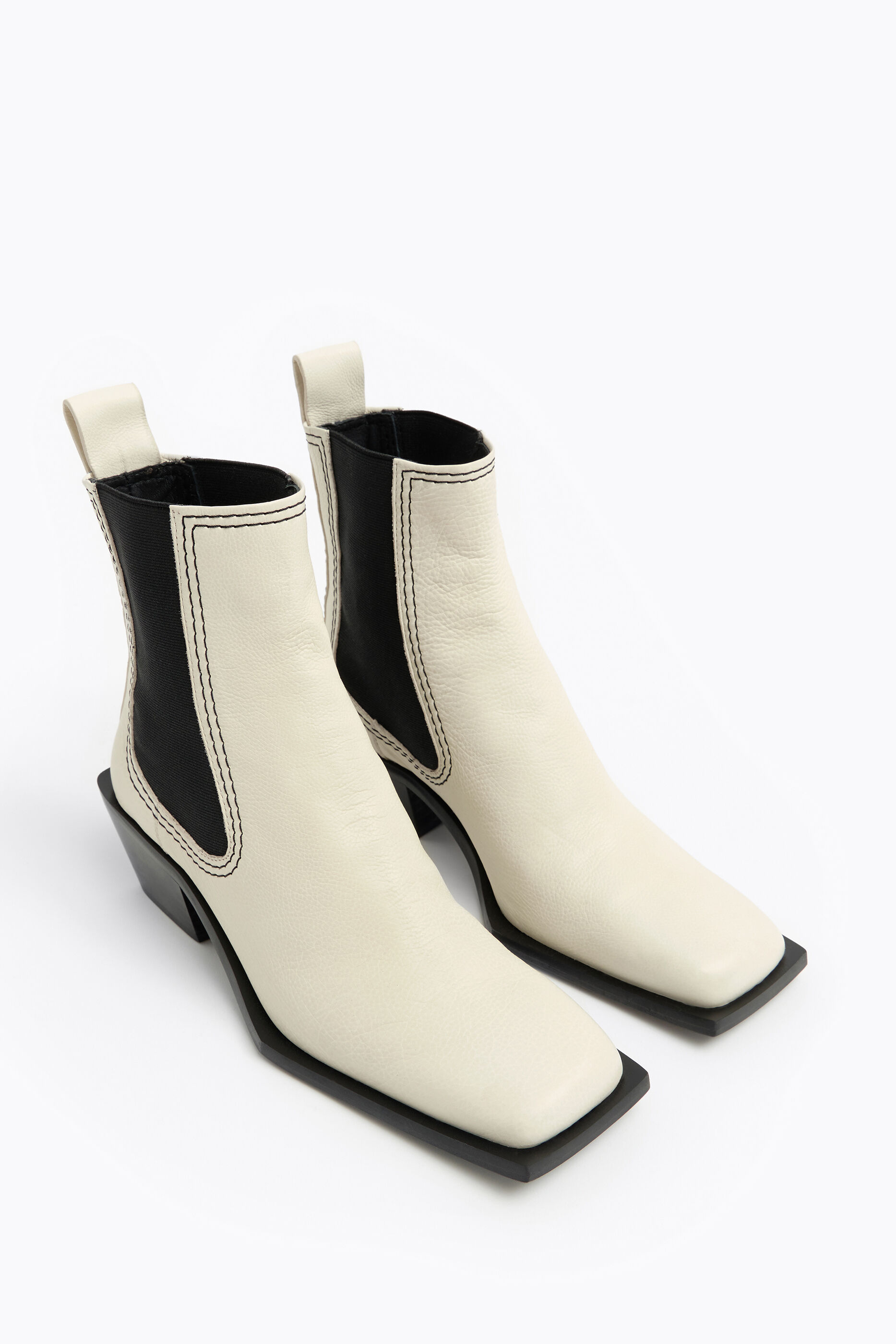 white leather flat ankle boots