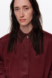 Short burgundy coated trench