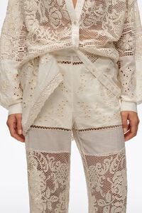 Ecru trousers with embroidery and openwork